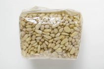 Pine nuts packed in cellophane bag — Stock Photo