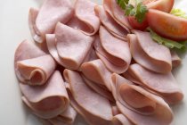 Slices of raw ham — Stock Photo