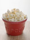 Popcorn in red bowl — Stock Photo