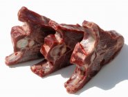 Three frozen lamb chops — Stock Photo