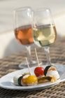 Closeup view of two aperitifs with appetizers — Stock Photo