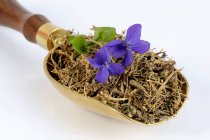 Violet roots and violets in a scoop — Stock Photo