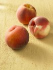 Three ripe peaches — Stock Photo