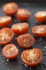 Cherry tomatoes sprinkled with vinaigrette — Stock Photo