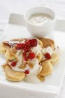 Pancakes with yoghurt and cranberries — Stock Photo