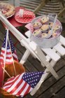Blueberry muffins on garden chair — Stock Photo