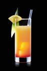 Tequila Sunrise cocktail with slices of lime — Stock Photo