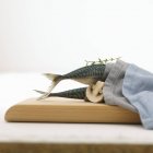 Mackerel tails in fabric napkin — Stock Photo
