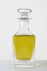 Olive oil in a glass bottle — Stock Photo