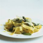 Ribbon pasta with green asparagus — Stock Photo
