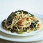 Spaghetti with scallops and rock samphire — Stock Photo