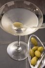 Glass of Martini with olives — Stock Photo