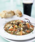 Irish stew with bread — Stock Photo