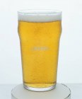 Glass of lager on white background — Stock Photo