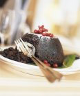 Christmas pudding on plate — Stock Photo
