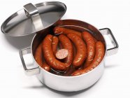 Boiled polish Sausages in pan — Stock Photo
