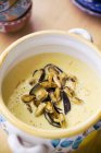 Mussel soup with saffron — Stock Photo