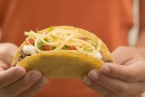 Hands  holding  taco — Stock Photo