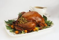 Stuffed turkey on a platter — Stock Photo