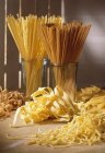 Various types of raw pasta on table — Stock Photo