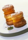 Doughnuts stacked with slices — Stock Photo