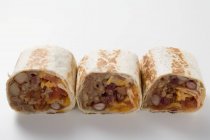 Three wraps filled with mince — Stock Photo