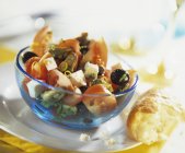 Closeup view of salad with tomatoes, mussels, feta and olives — Stock Photo