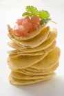 Stacked Tortilla chips with tomato salsa — Stock Photo