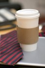 Take-away Coffee cup and tie — Stock Photo