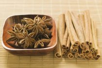 Star anise in wooden bowl — Stock Photo