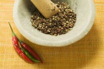 Szechuan pepper in mortar — Stock Photo
