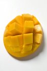 Fresh diced mango in cubes on skin — Stock Photo