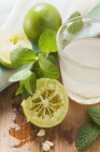 Lime juice in glass — Stock Photo