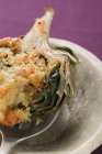 Stuffed artichoke with gratin topping — Stock Photo