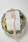 Sandwich with napkin and fork — Stock Photo