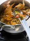Crayfish stew in stew pan — Stock Photo