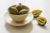 Kiwi fruits in bowl — Stock Photo