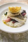 Sea bass fillets with risotto rice — Stock Photo