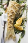 Fried sea bass with herbs — Stock Photo
