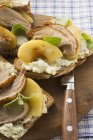 Open sandwiches of duck breast — Stock Photo