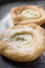 Closeup view of Auszogene Bavarian fried pastries with icing sugar — Stock Photo