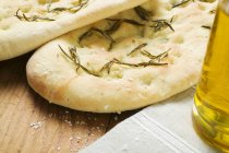 Closeup view of Focaccia with rosemary and salt — Stock Photo