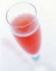 Closeup view of Bellini cocktail on white background — Stock Photo