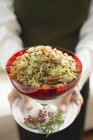 Bowl of vegetable rice with pecans — Stock Photo