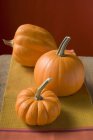 Pumpkins on kitchen towel — Stock Photo