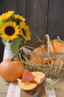 Rustic pumpkins with sunflowers — Stock Photo