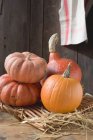Pumpkins and squashes on wicker tray — Stock Photo