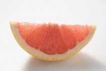 Wedge of pink grapefruit — Stock Photo
