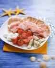 Antipasti of ham on plate — Stock Photo