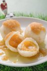 Closeup view of apricot dumplings with football figure and football — Stock Photo